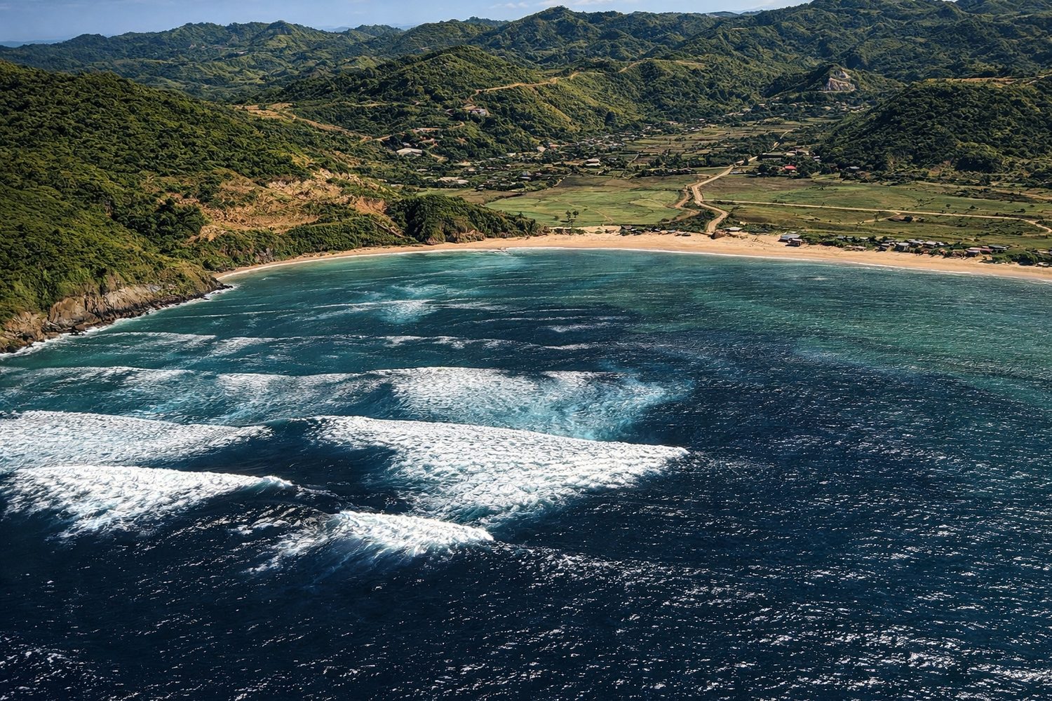 Aerial of Are Guling coastline with waves